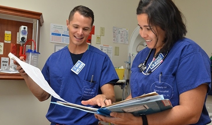 Healthcare workers consulting a chart