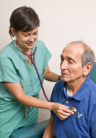 Female healthcare worker examining patient