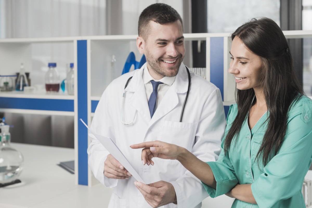 Smiling medical professional with a patient