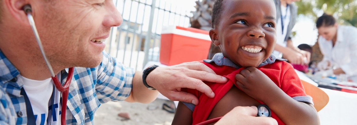 Doctor giving checkups to underprivileged kids