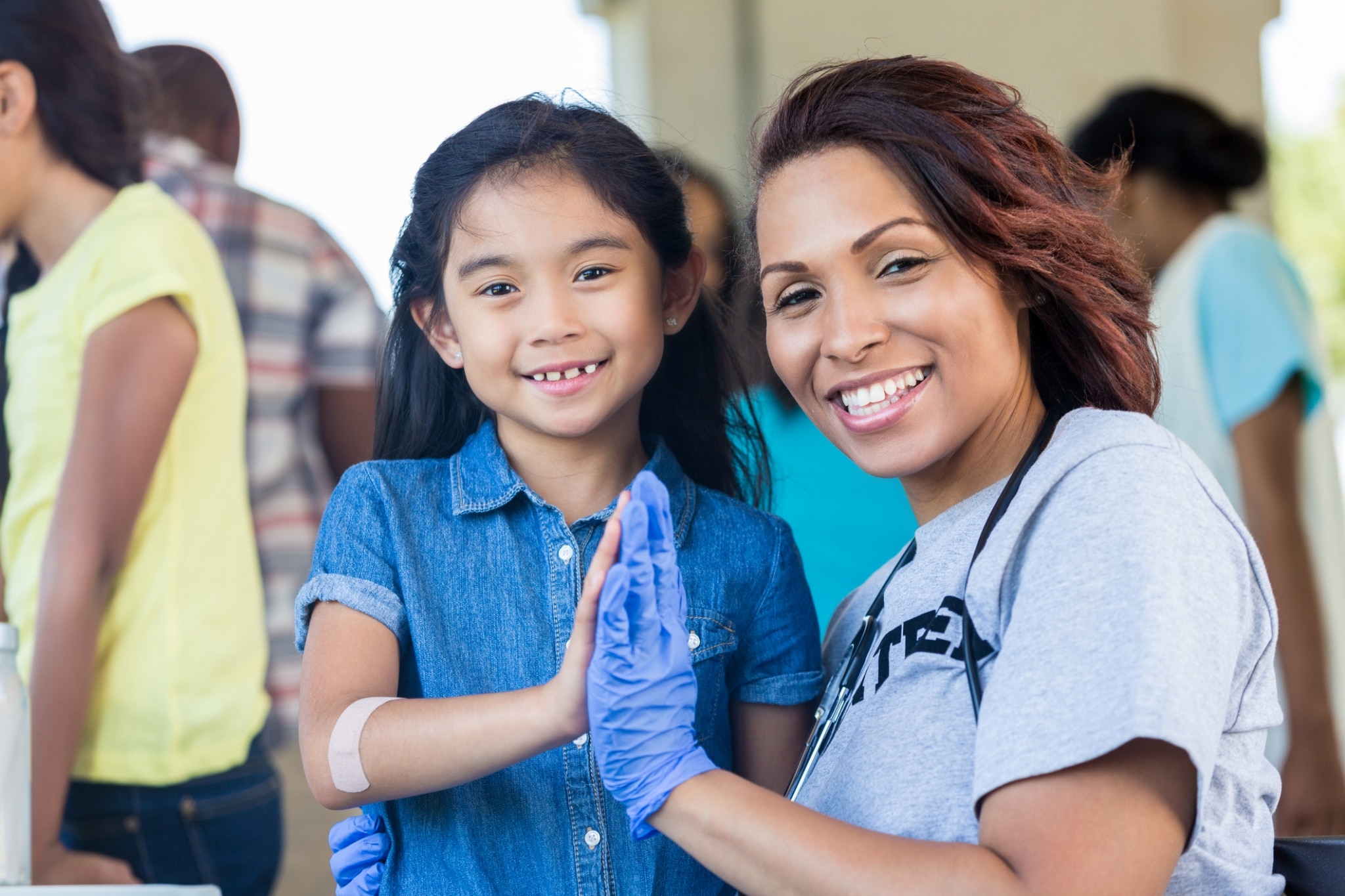 Female nurse volunteering at health fair