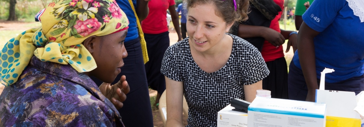 Volunteer medical staff assisting a woman