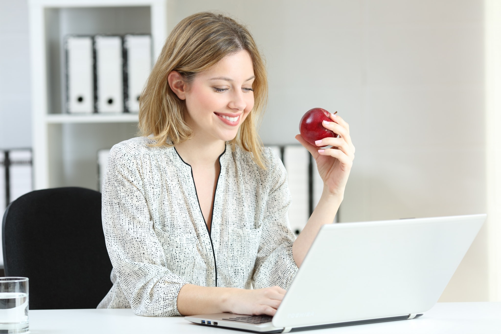 Healthy businesswoman at her desk