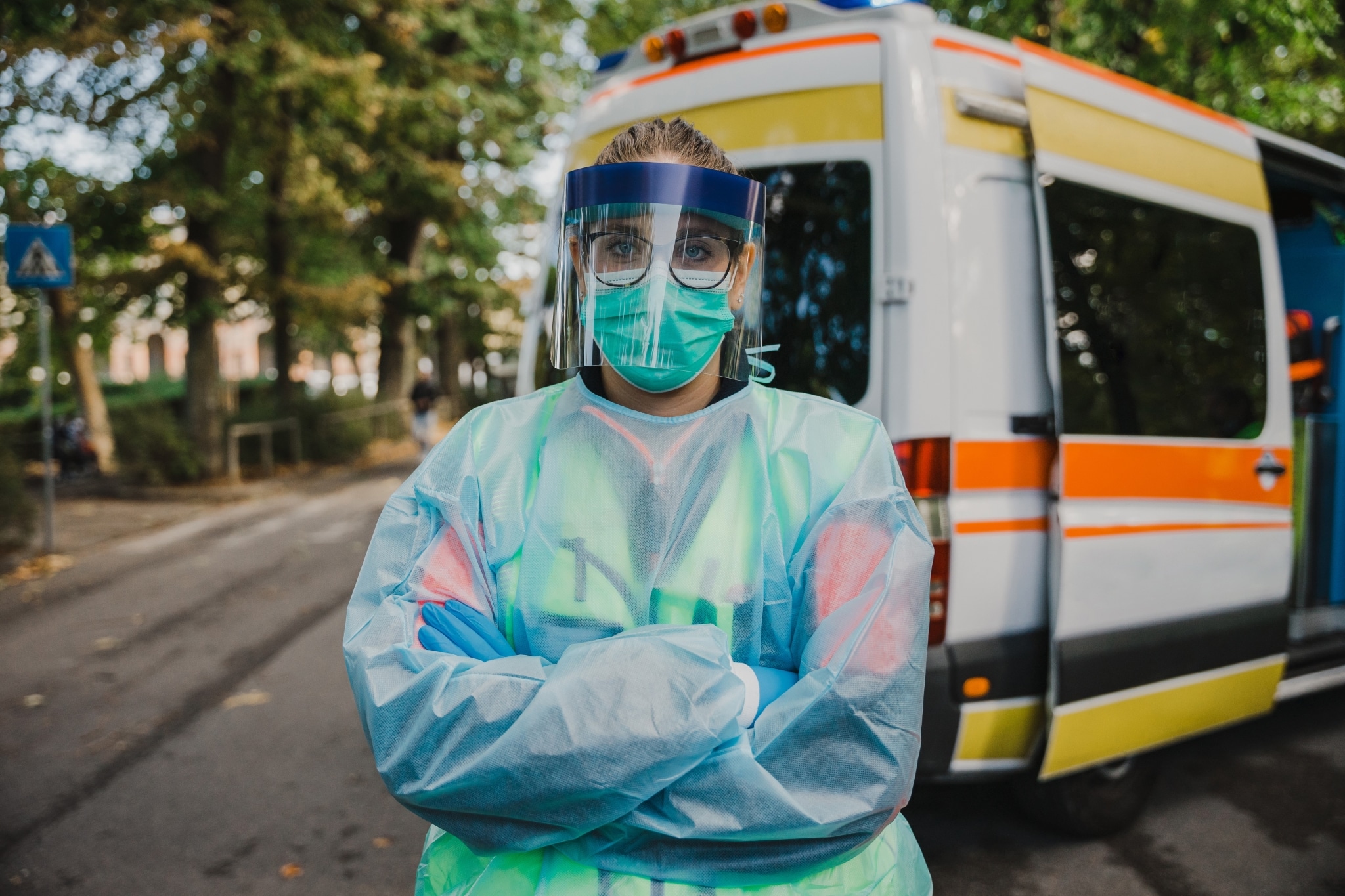 Nurse standing outside in protective gear