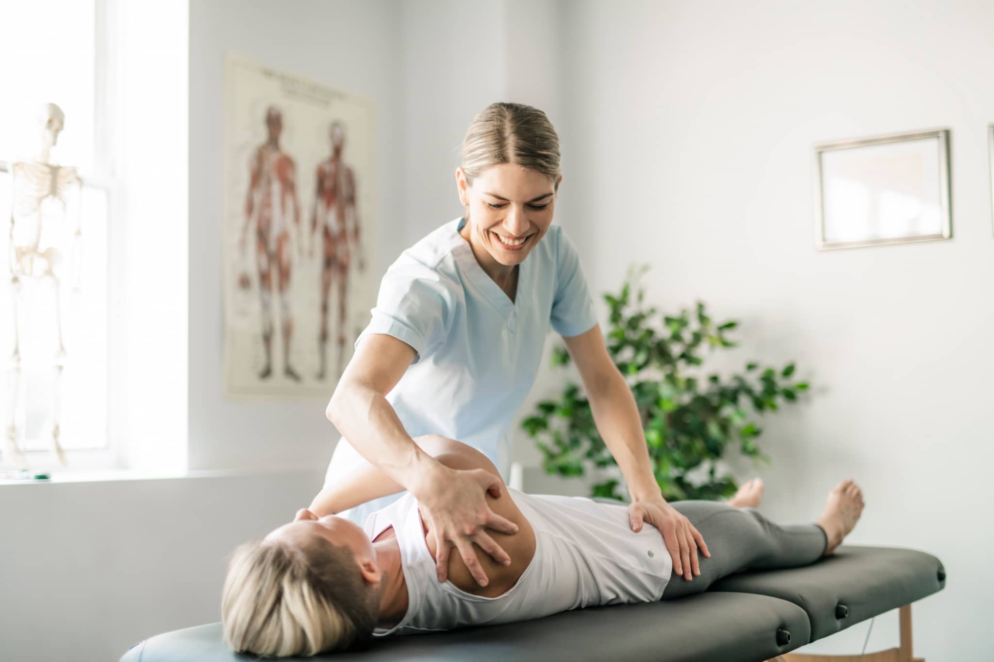 Physical Therapist Assistant assisting a patient