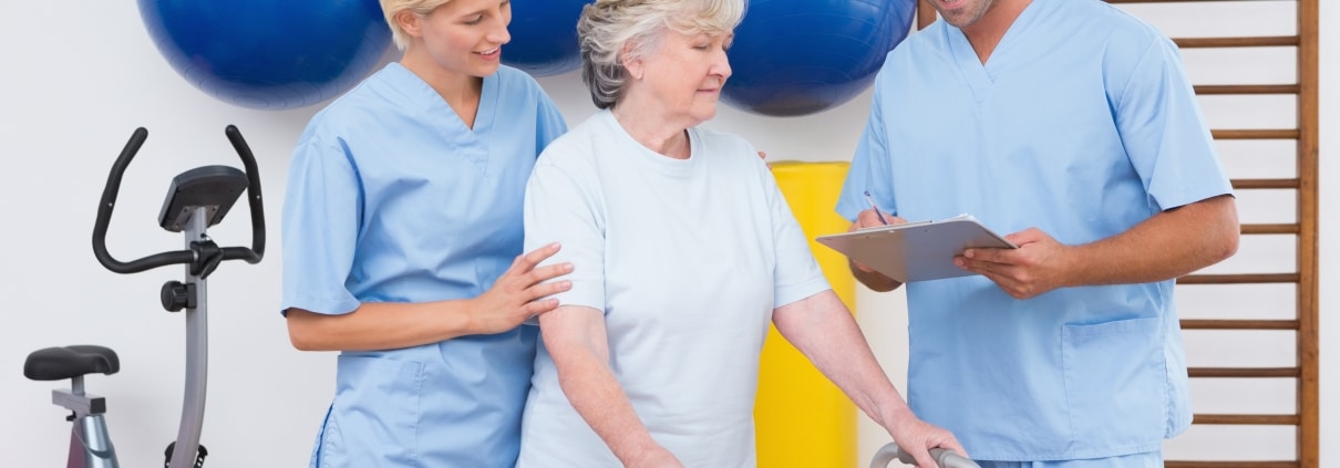 Physical therapy team with a patient