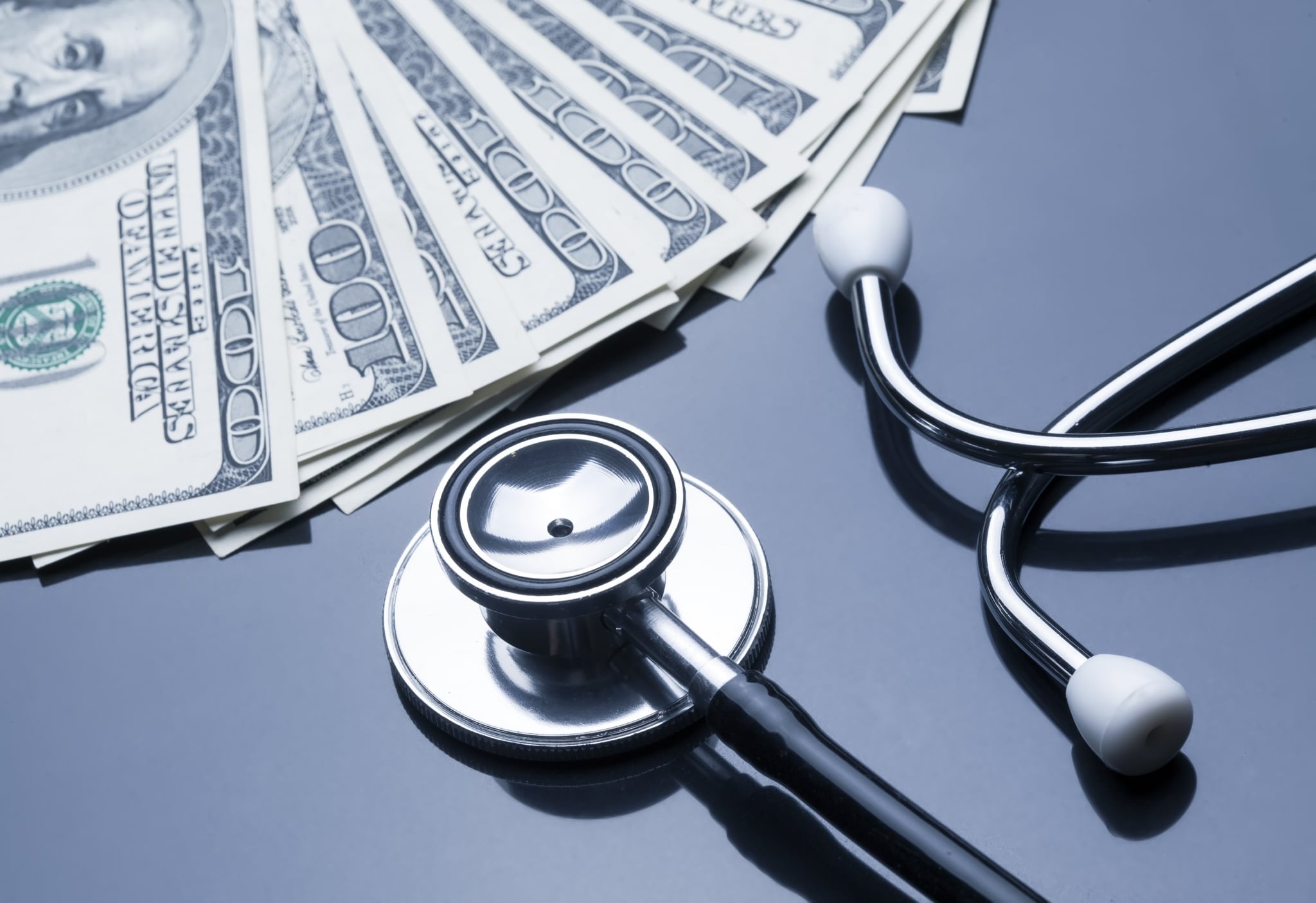 Stethoscope next to money