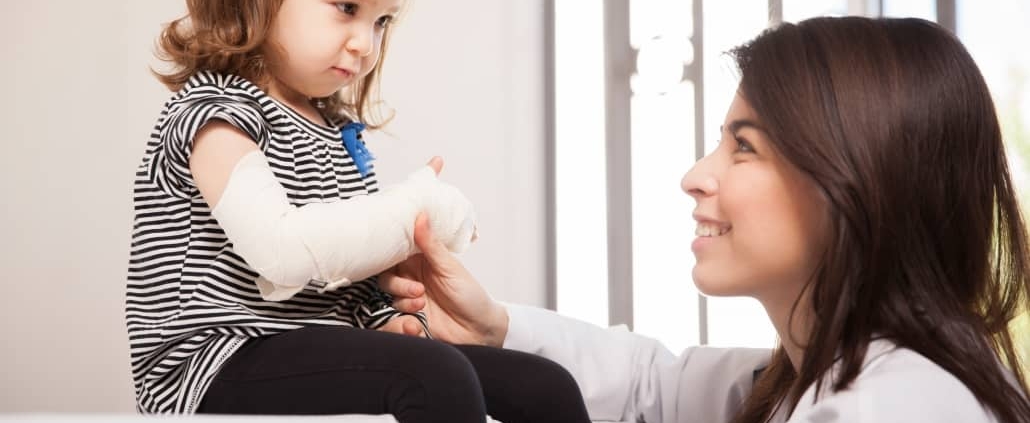 Female nurse with a pediatric patient