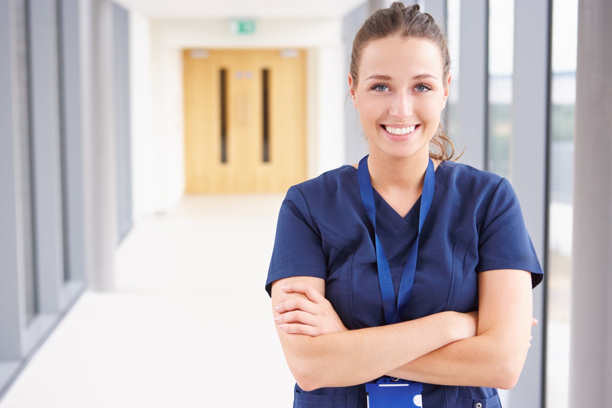 Smiling nurse in a hospital hallway