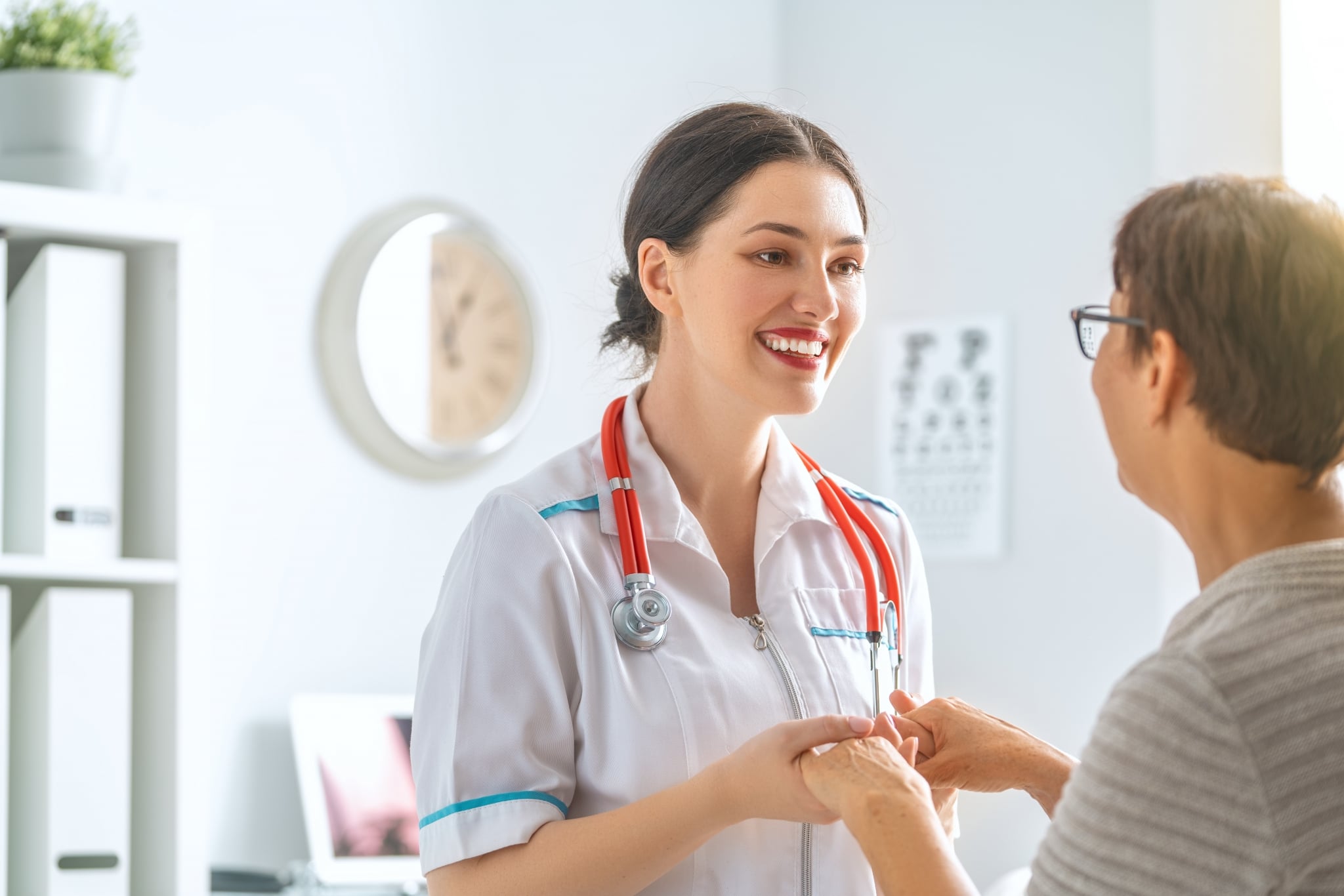 Female medical professional speaking with a patient