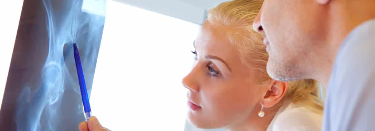 Two Orthopedic Nurse Practitioners Examining X-rays