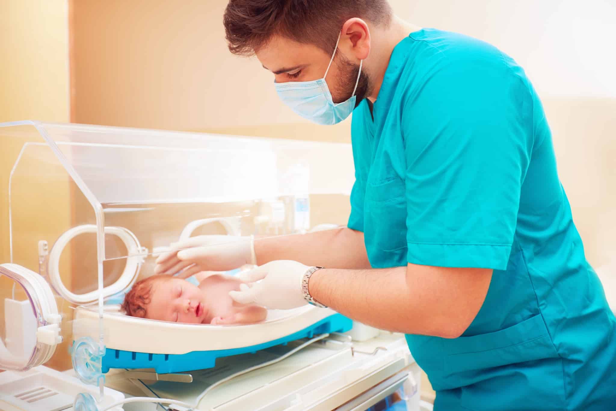 Medical staff taking care of a newborn baby