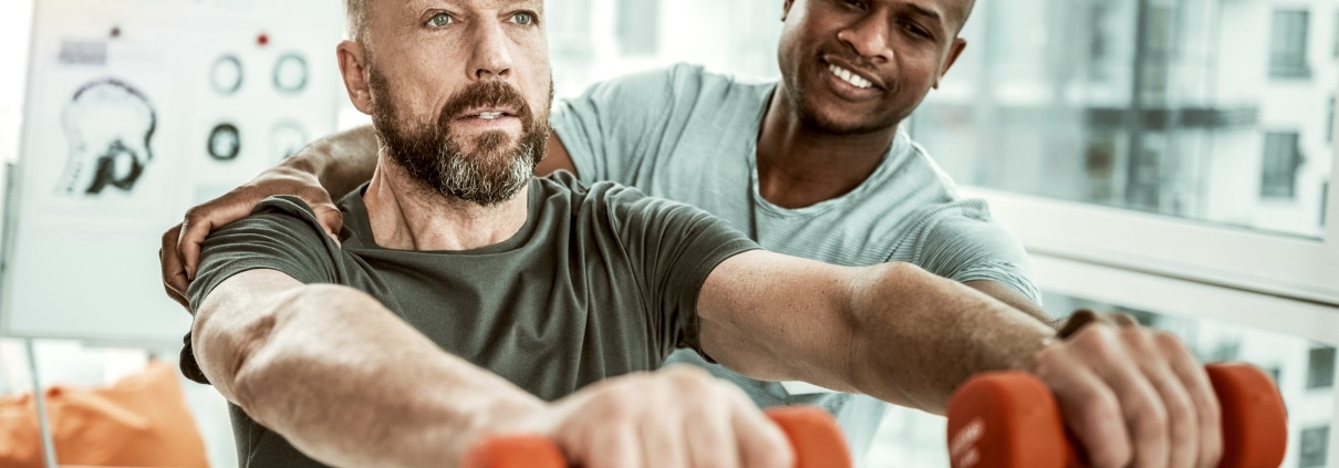 Physical Therapist Assistant with a male patient