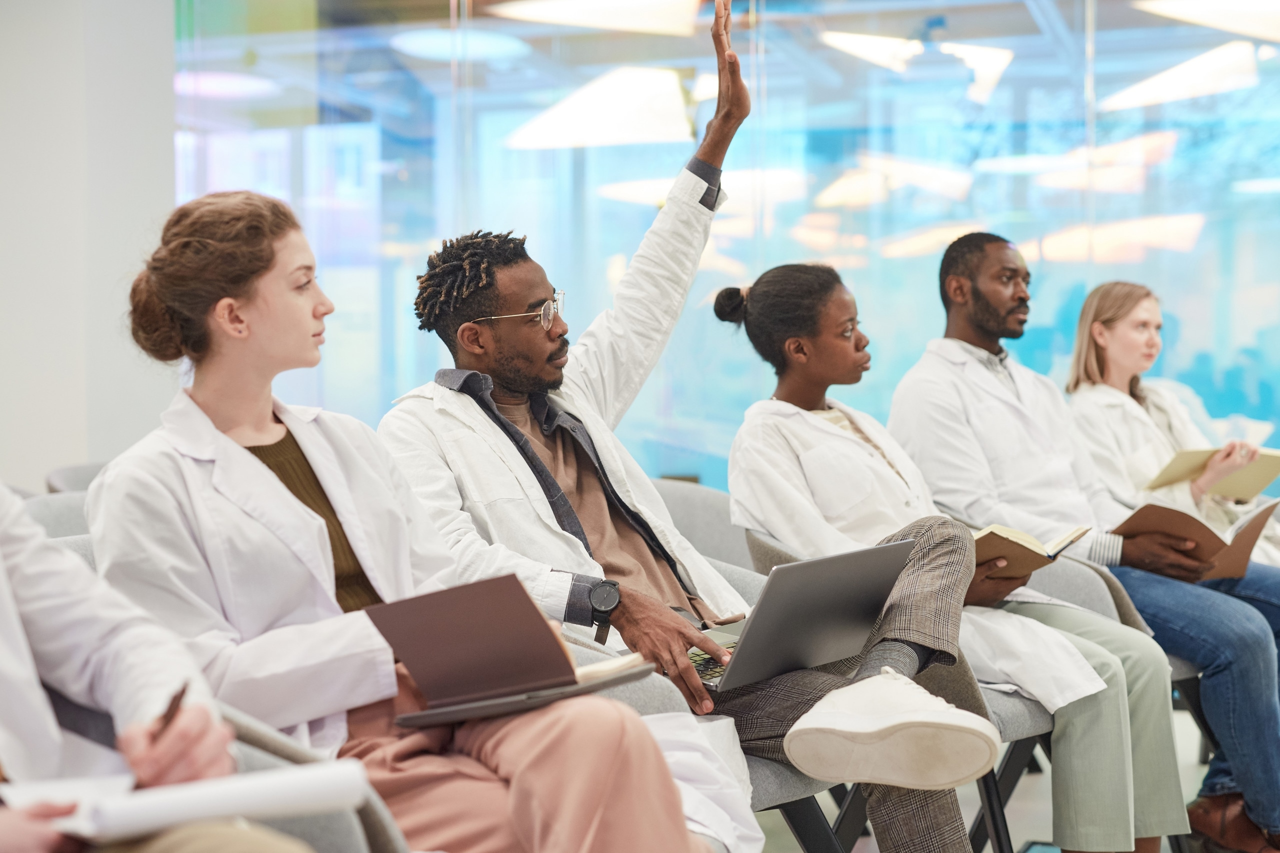 Multi-ethnic group of professionals in lab coats