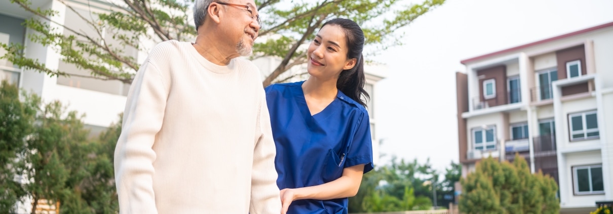 Physical Therapist Assistant outside with a patient
