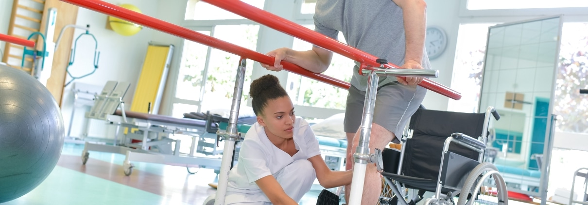 Physical Therapist Assistant with a disabled patient