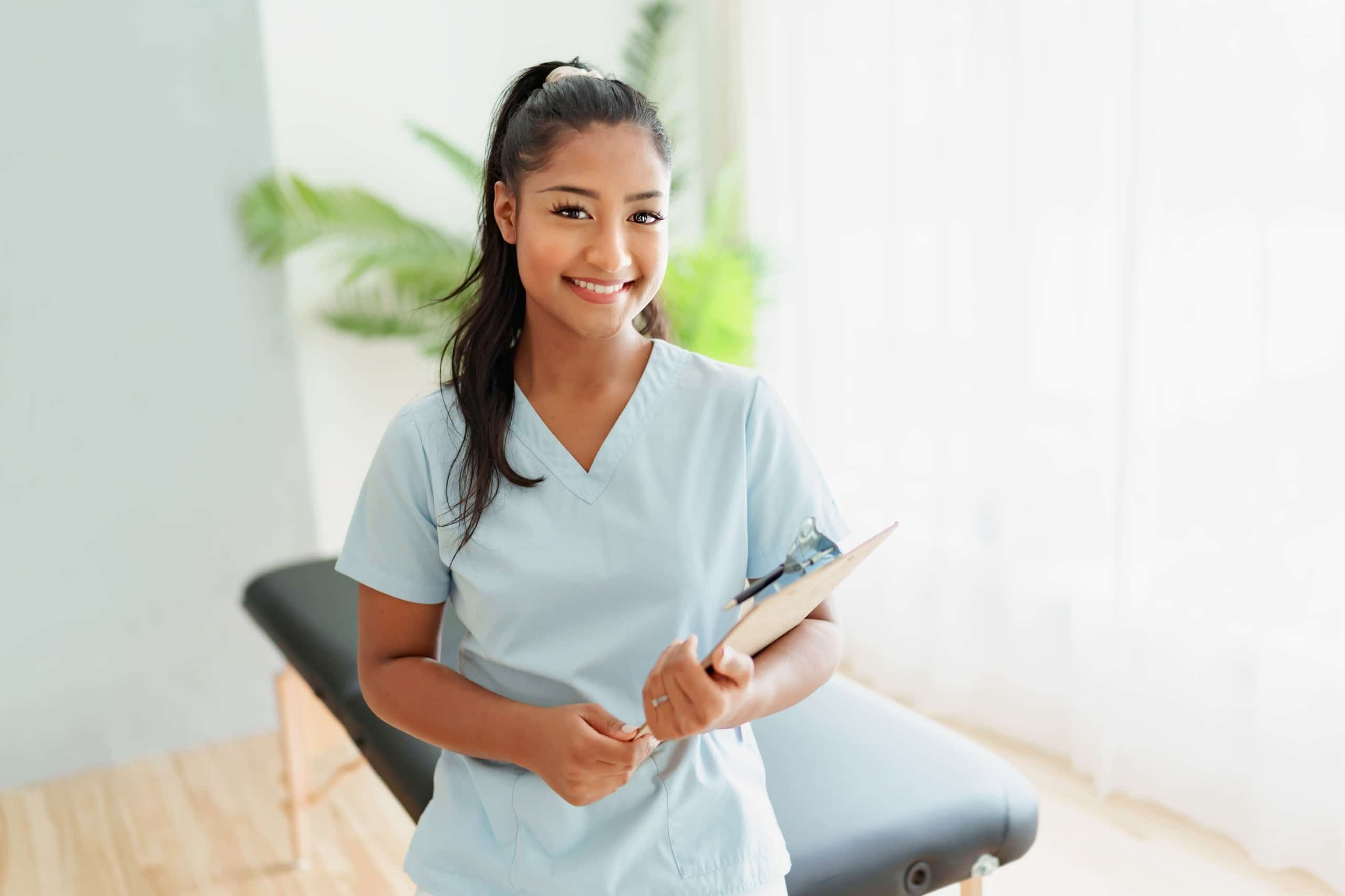 A young rehabilitation worker in an exam room