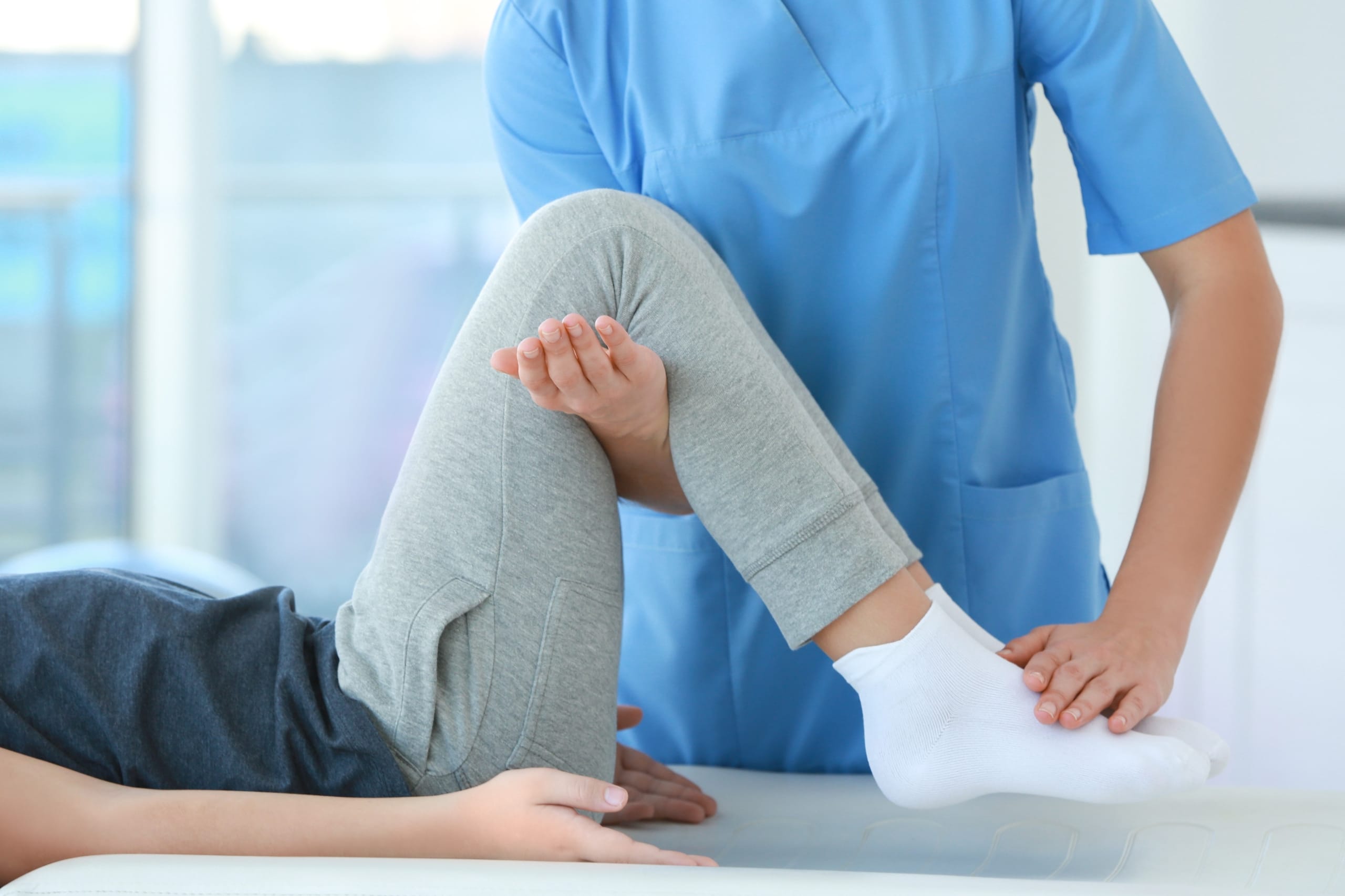 Physical therapist assistant working with a patient