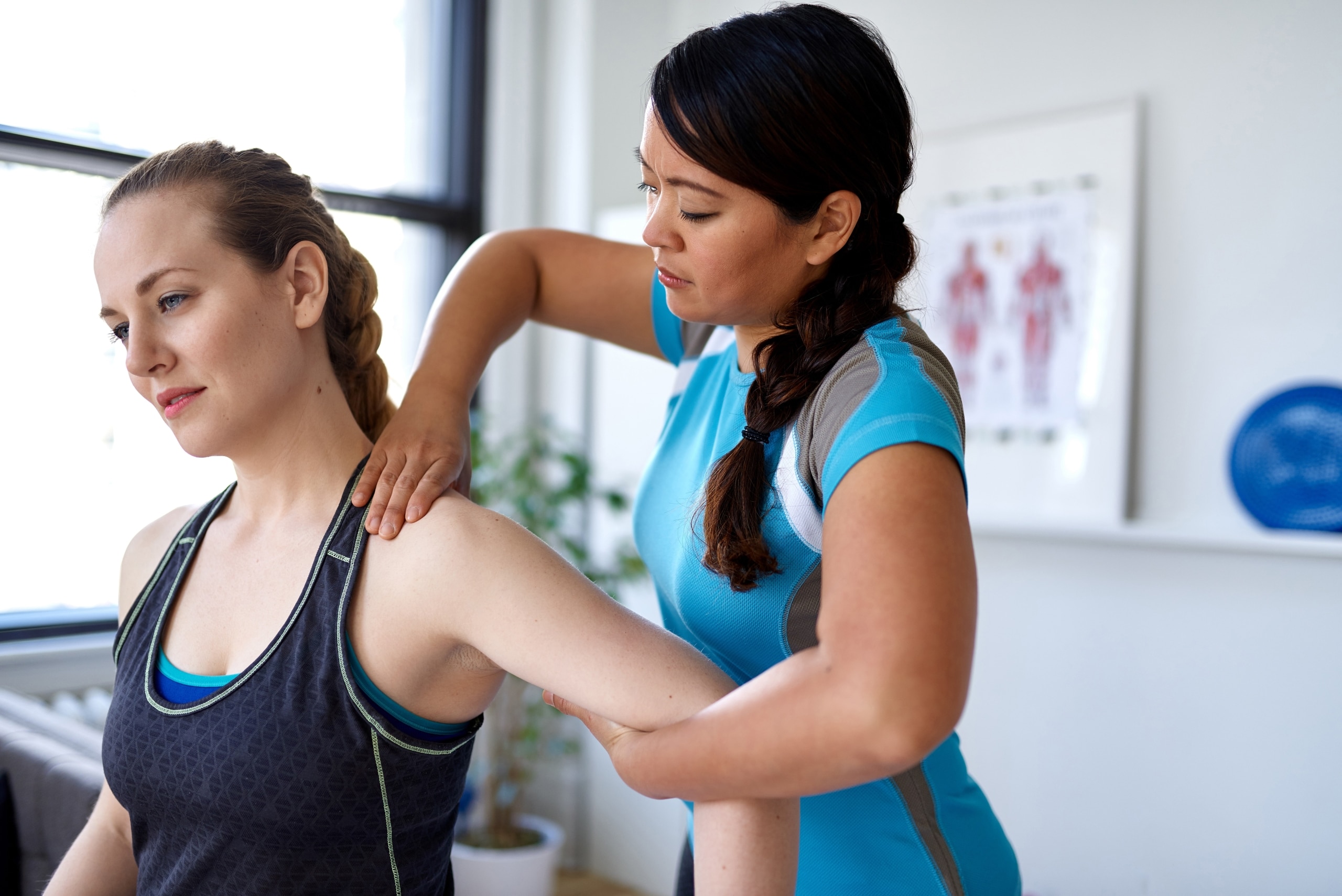 Physical therapist massaging a patient