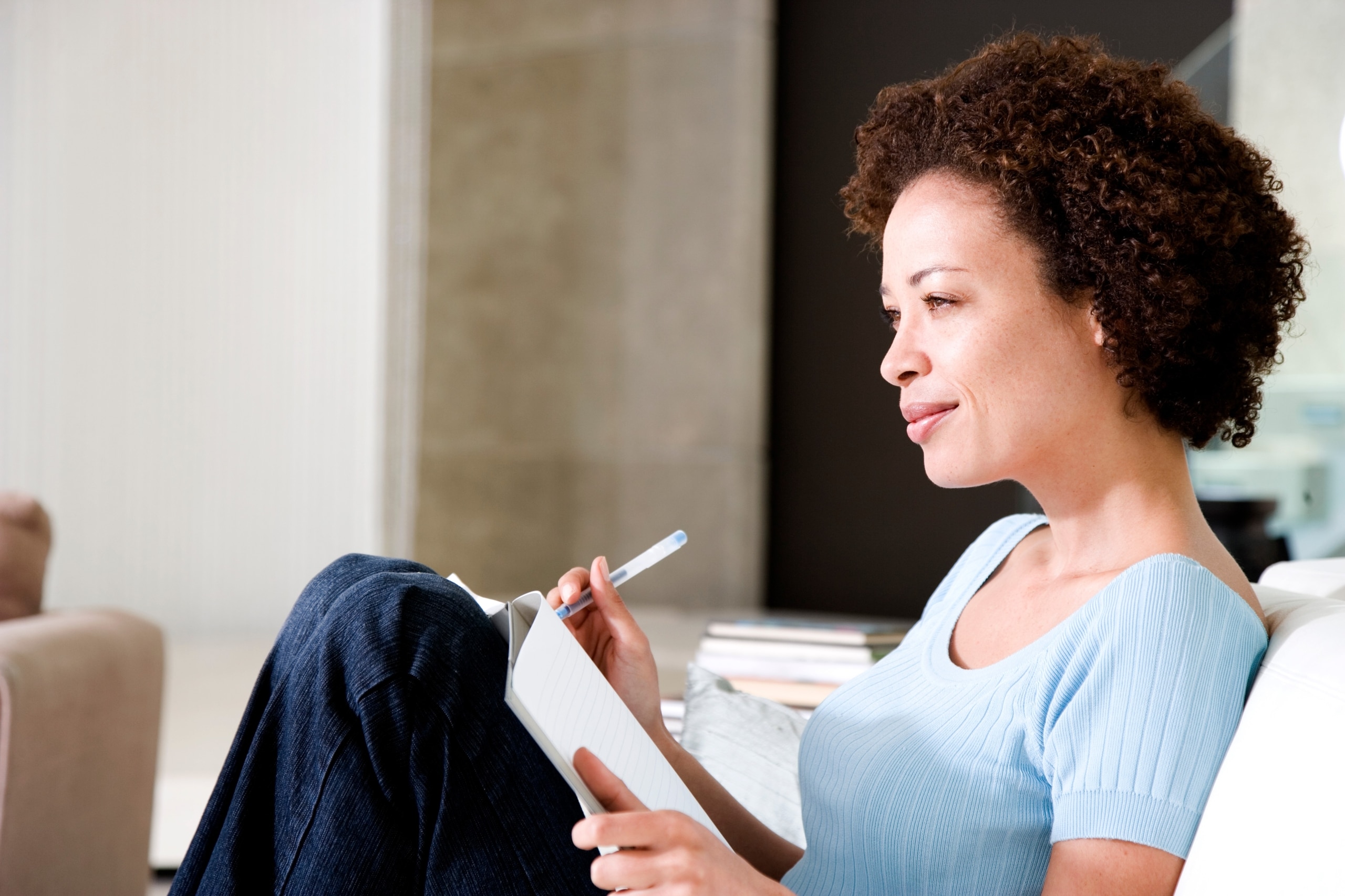 Woman writing in a journal