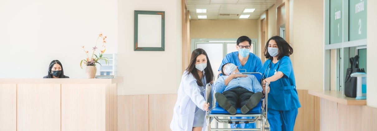 Emergency medical team transporting a patient