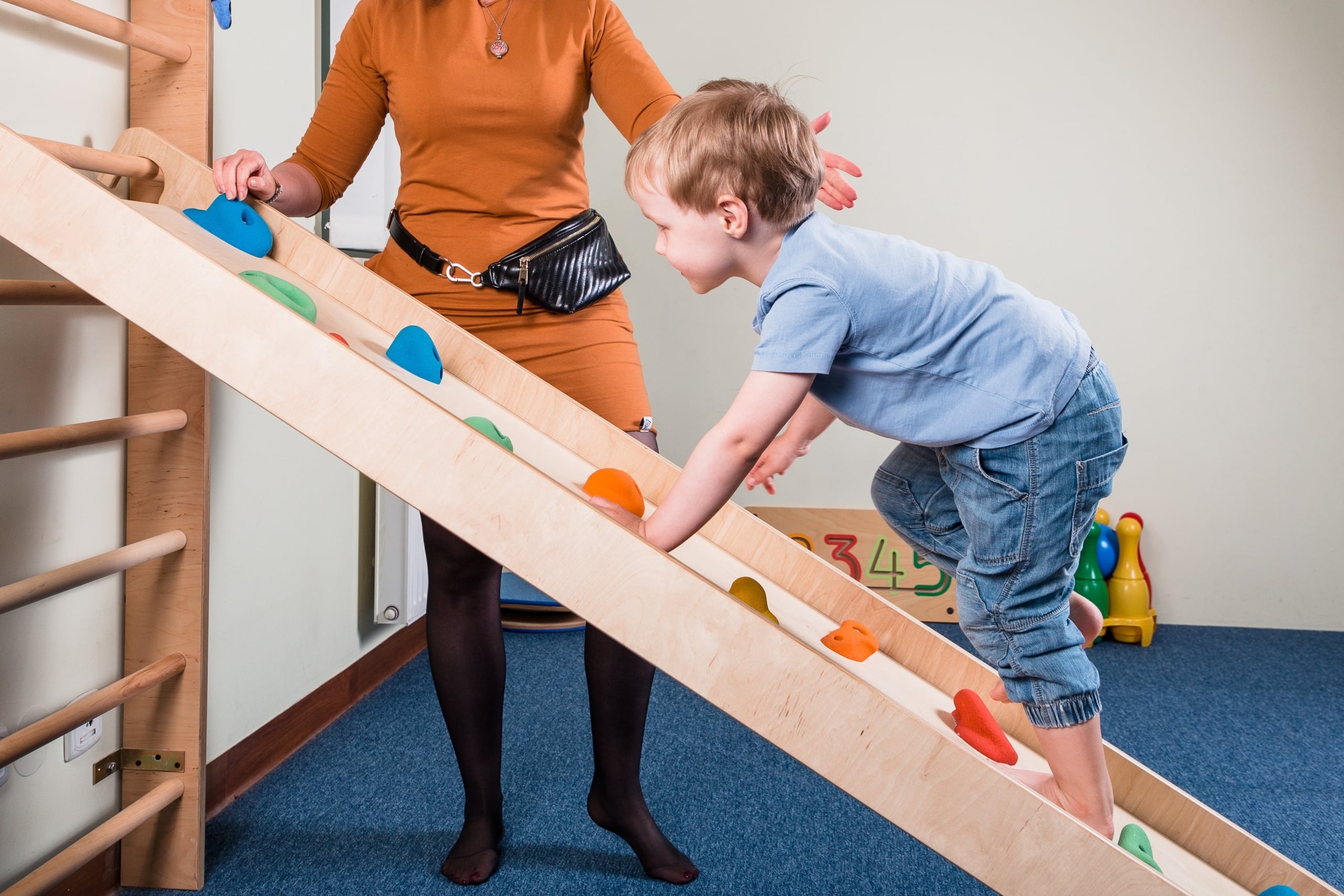 Child climbing a structure for sensory therapy