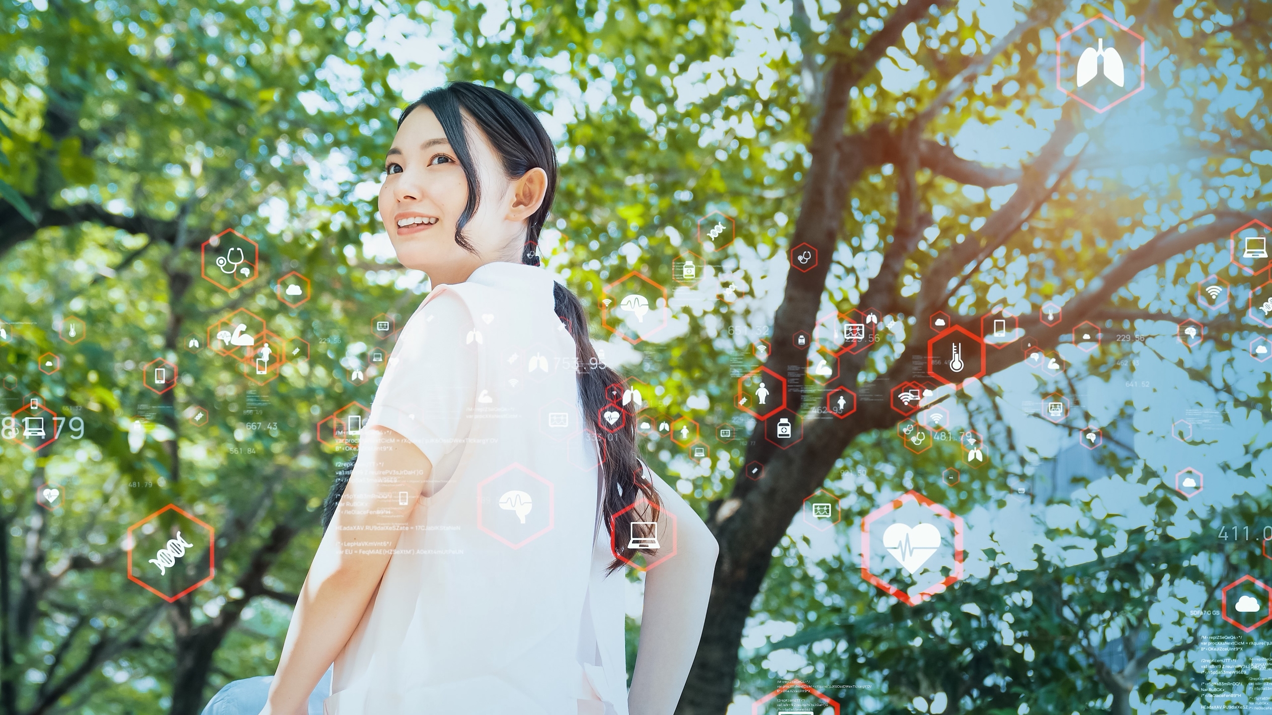 Smiling nurse outside with medical symbols in the background
