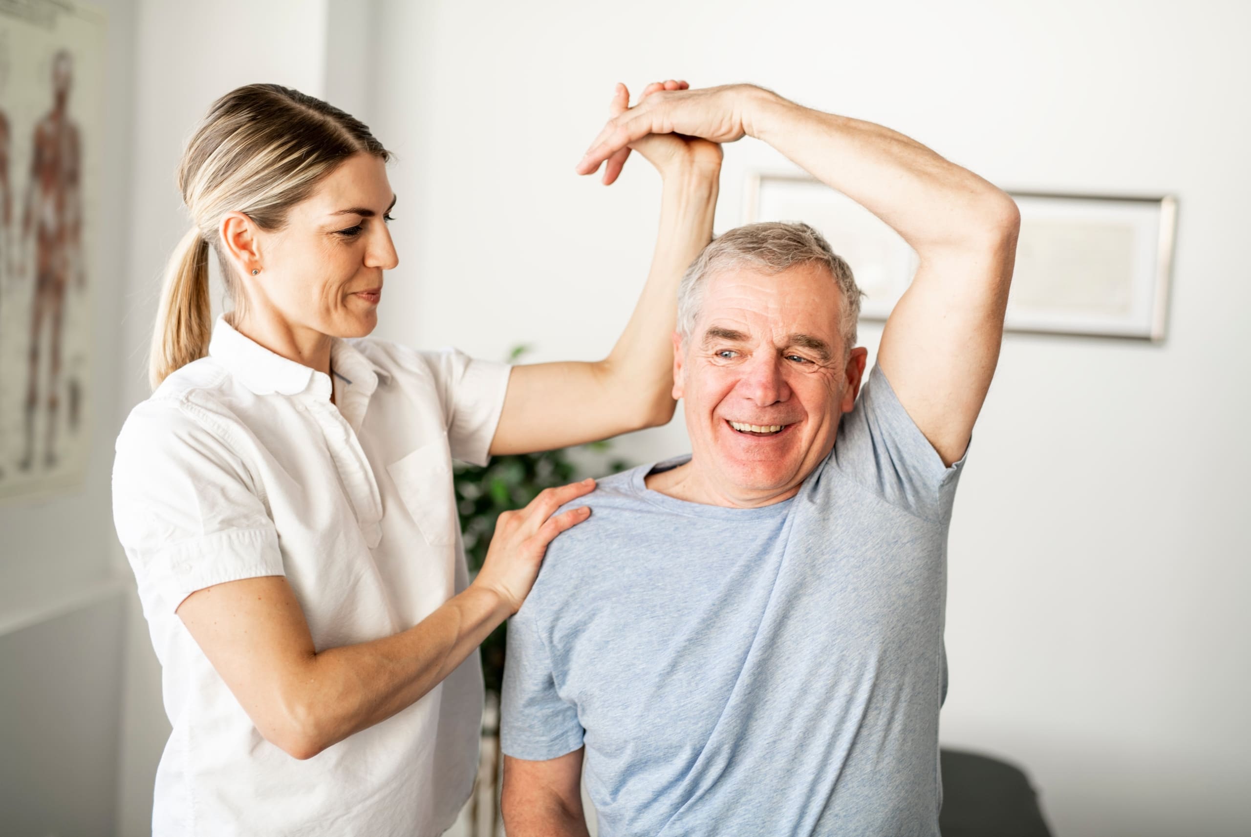 Older man performing exercises in physical therapy