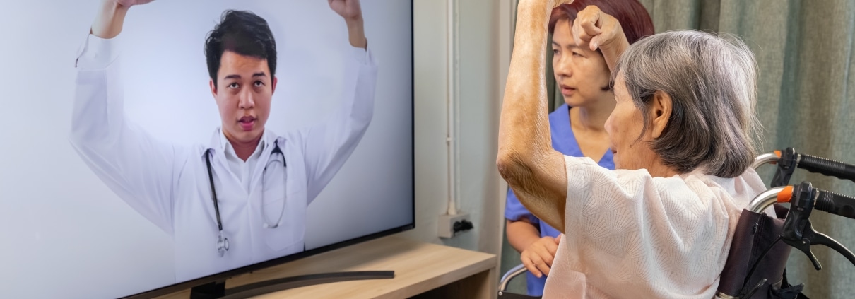 Elderly Asian woman in a telehealth physical therapy appointment