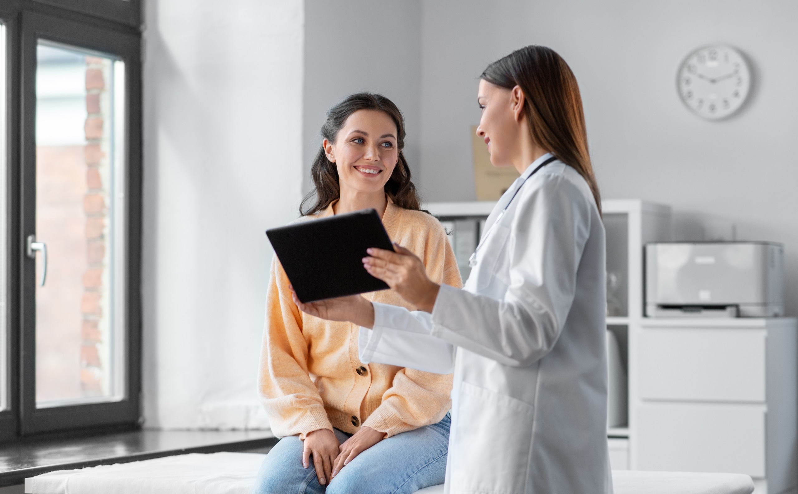 Healthcare professional consulting with a patient