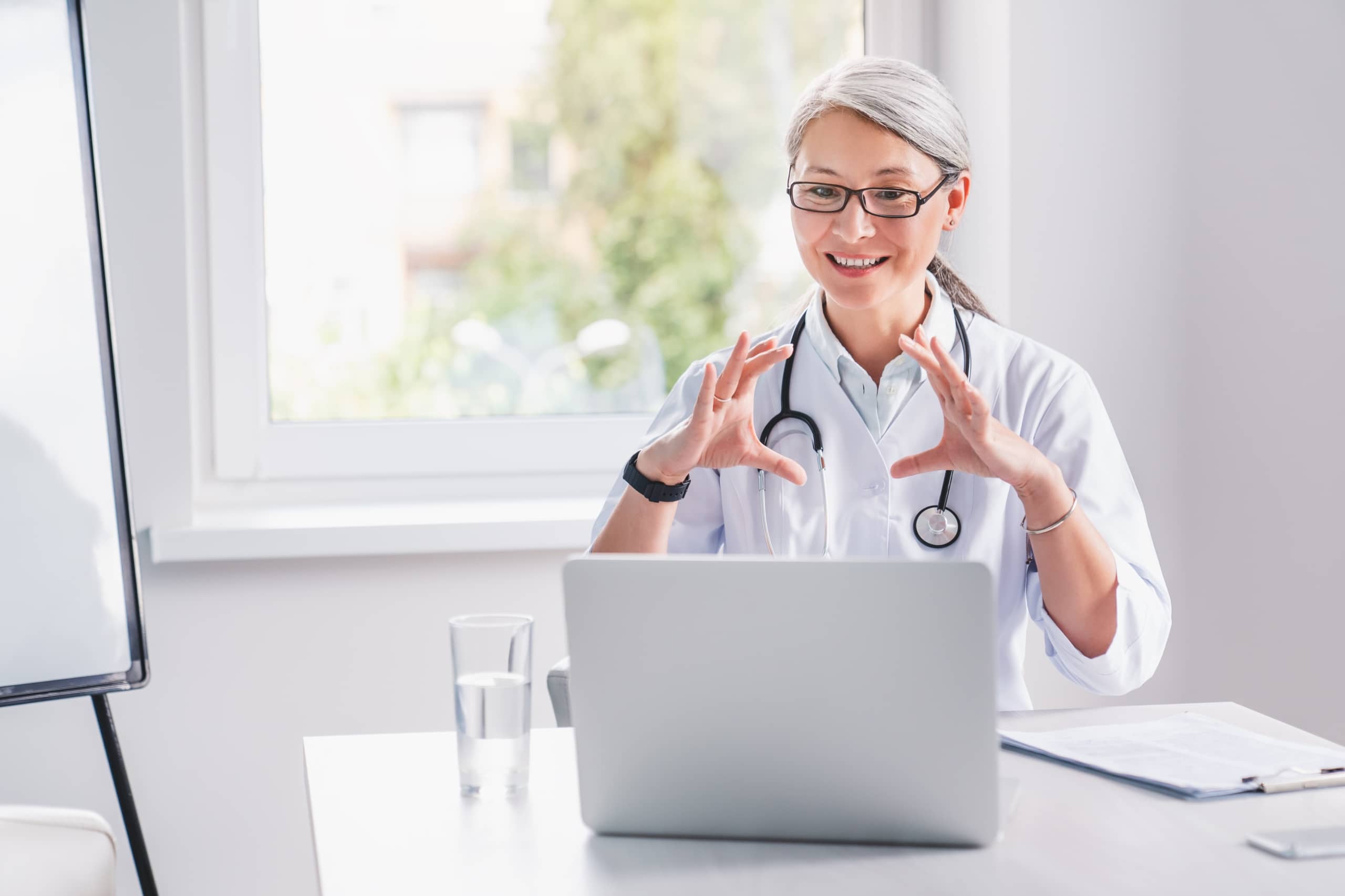 Older female medical professional in a telehealth appointment