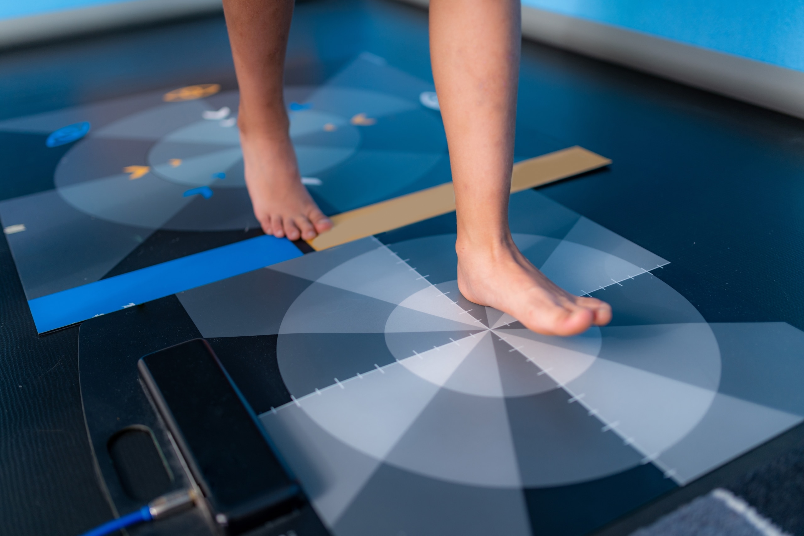 Close up of a person measuring their gait analysis using a foot plate