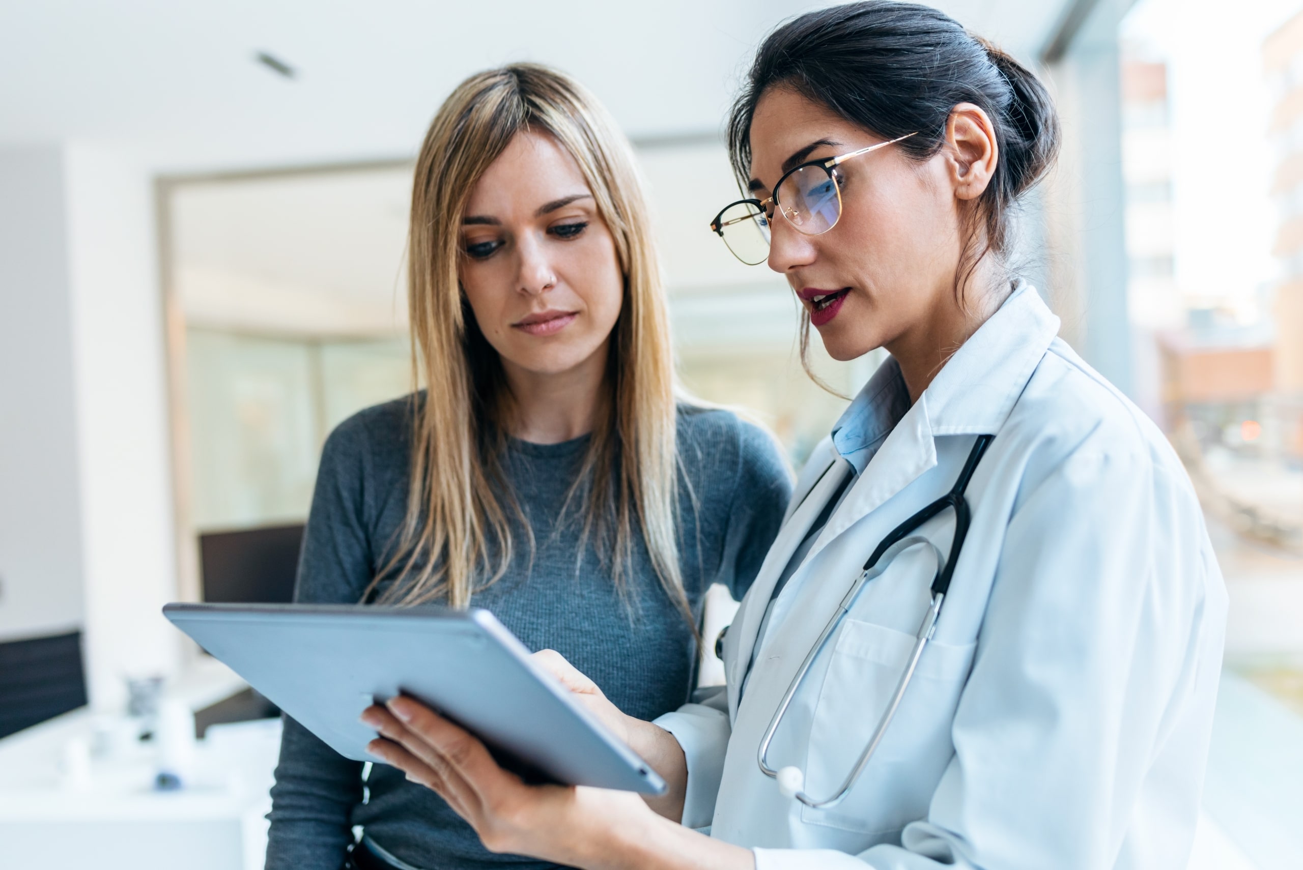 Female medical professional educating a patient