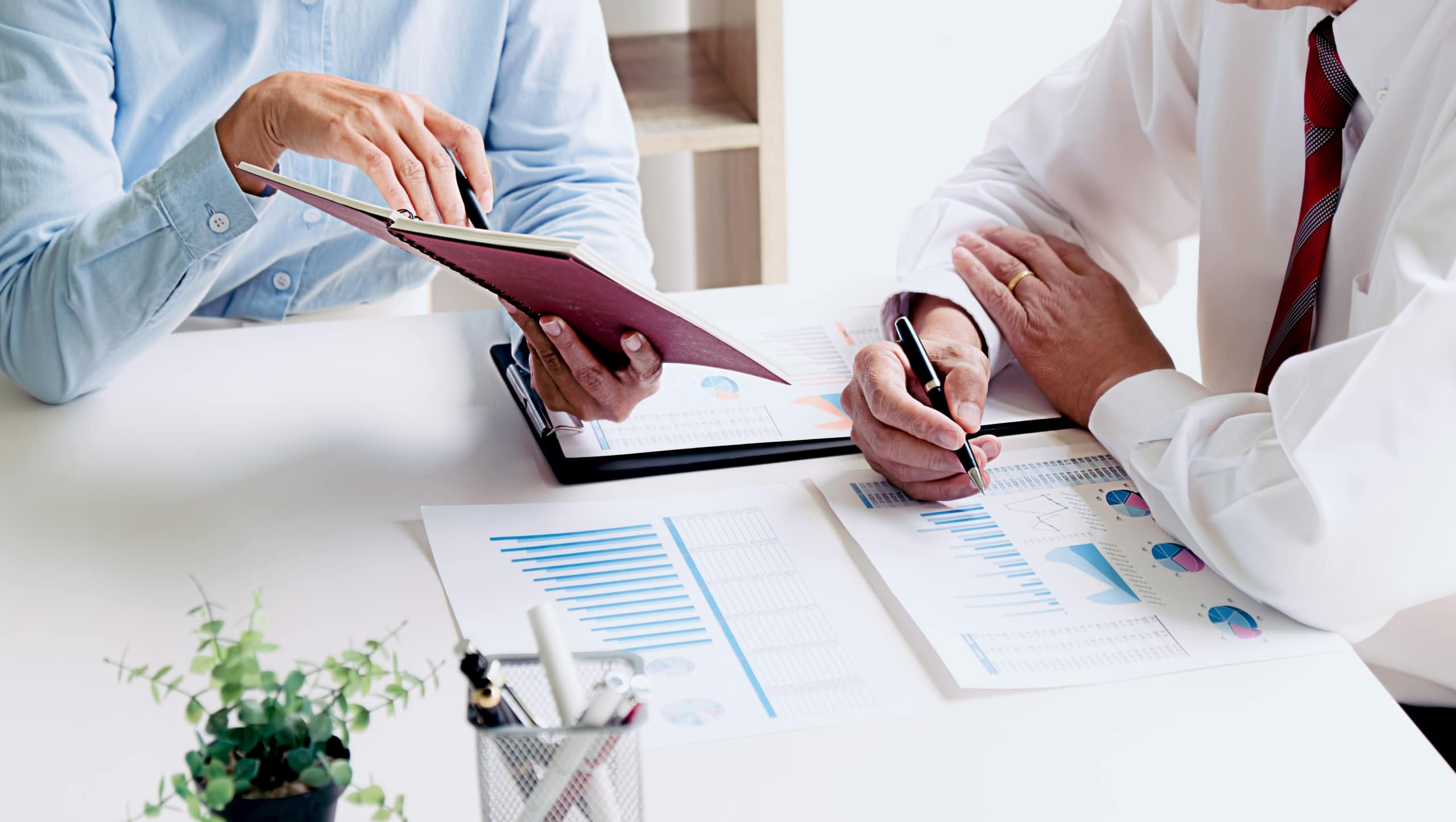 Close up of two business professionals at a table