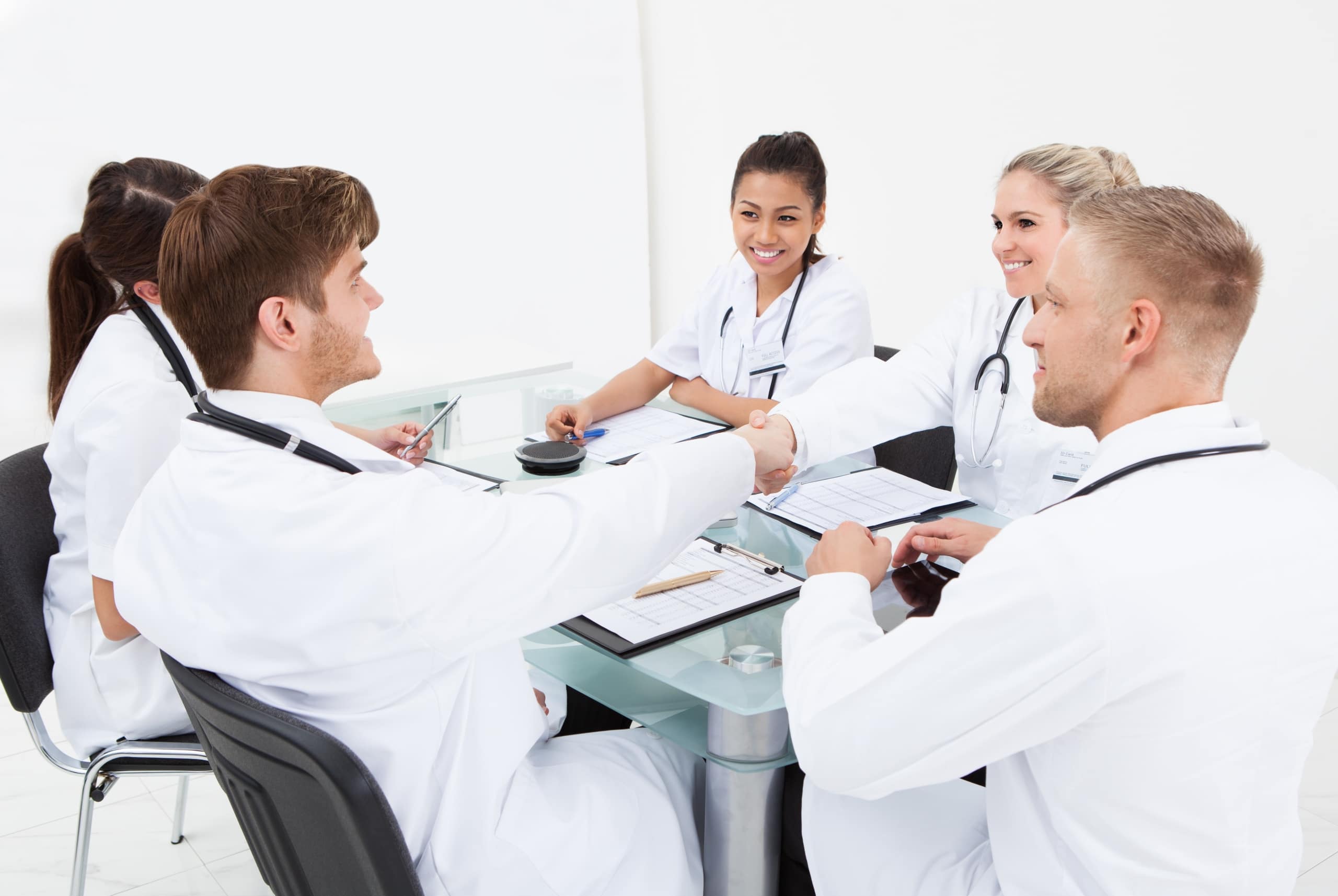 Group of medical professionals sitting around a table