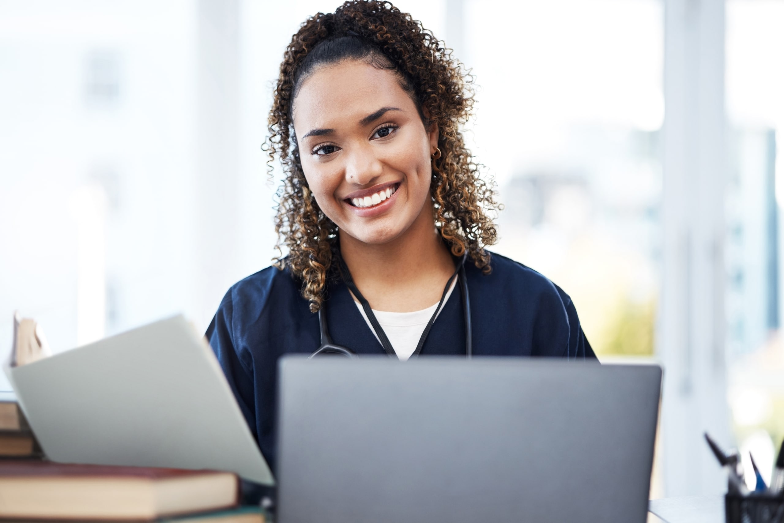 African-American medical professional at a desk