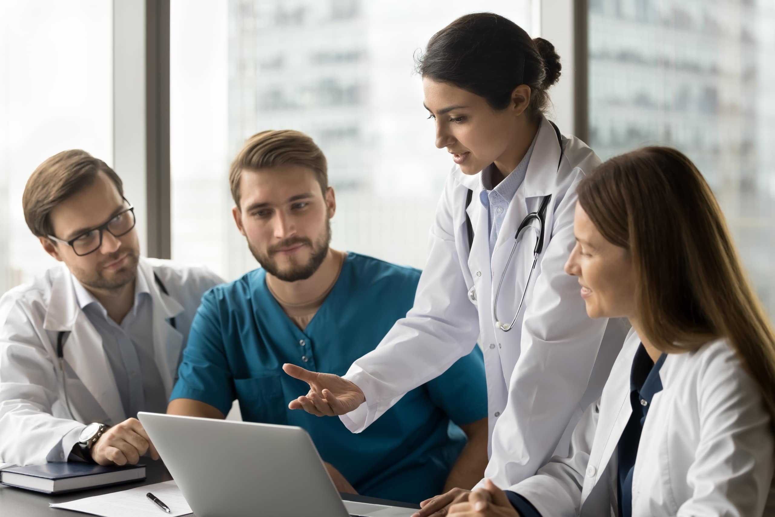 Indian woman meeting with other medical professionals