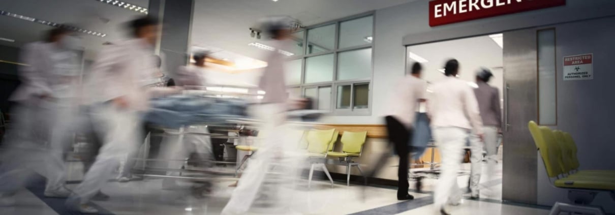 Blurred medical professionals in an emergency room