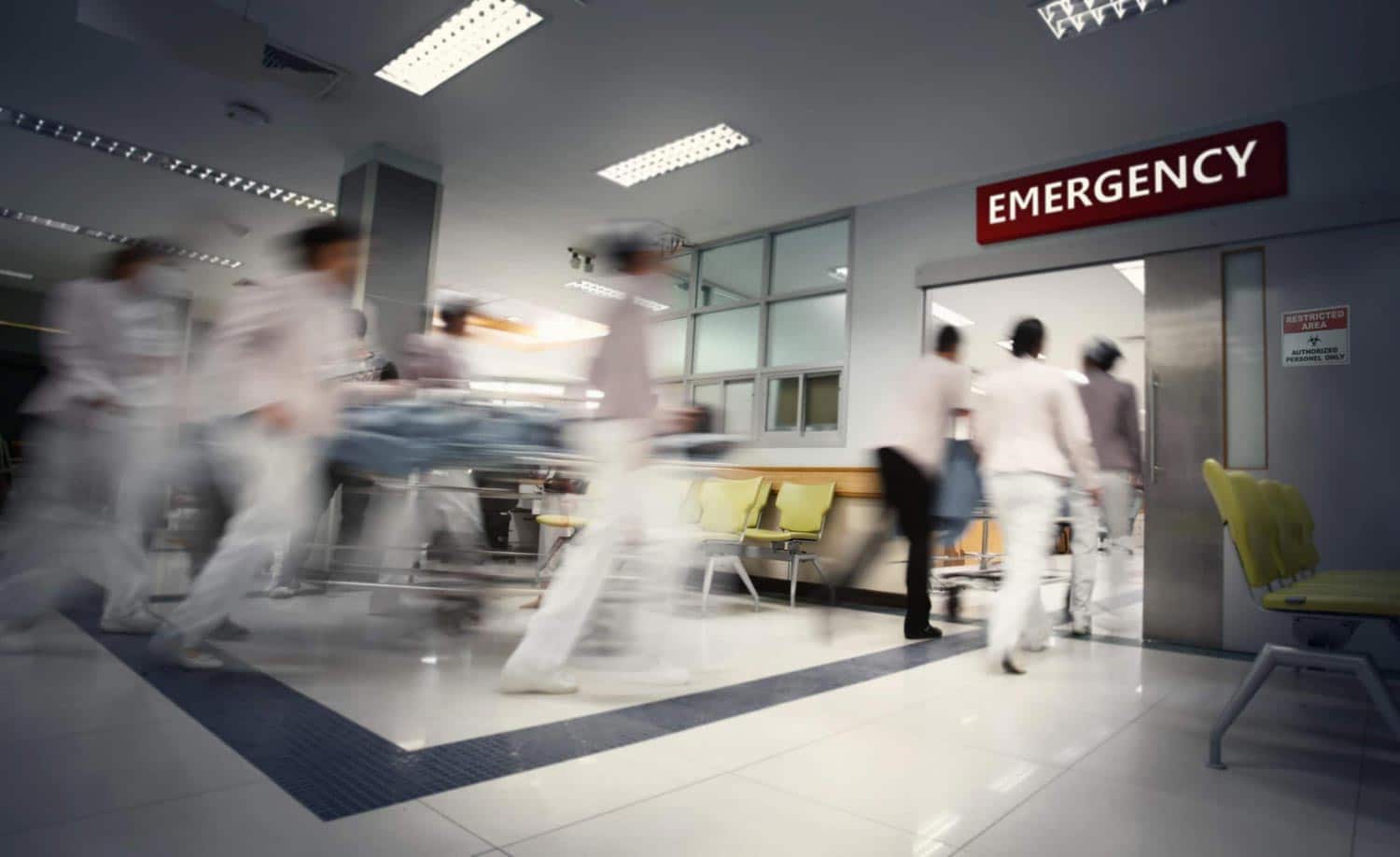 Blurred medical professionals in an emergency room