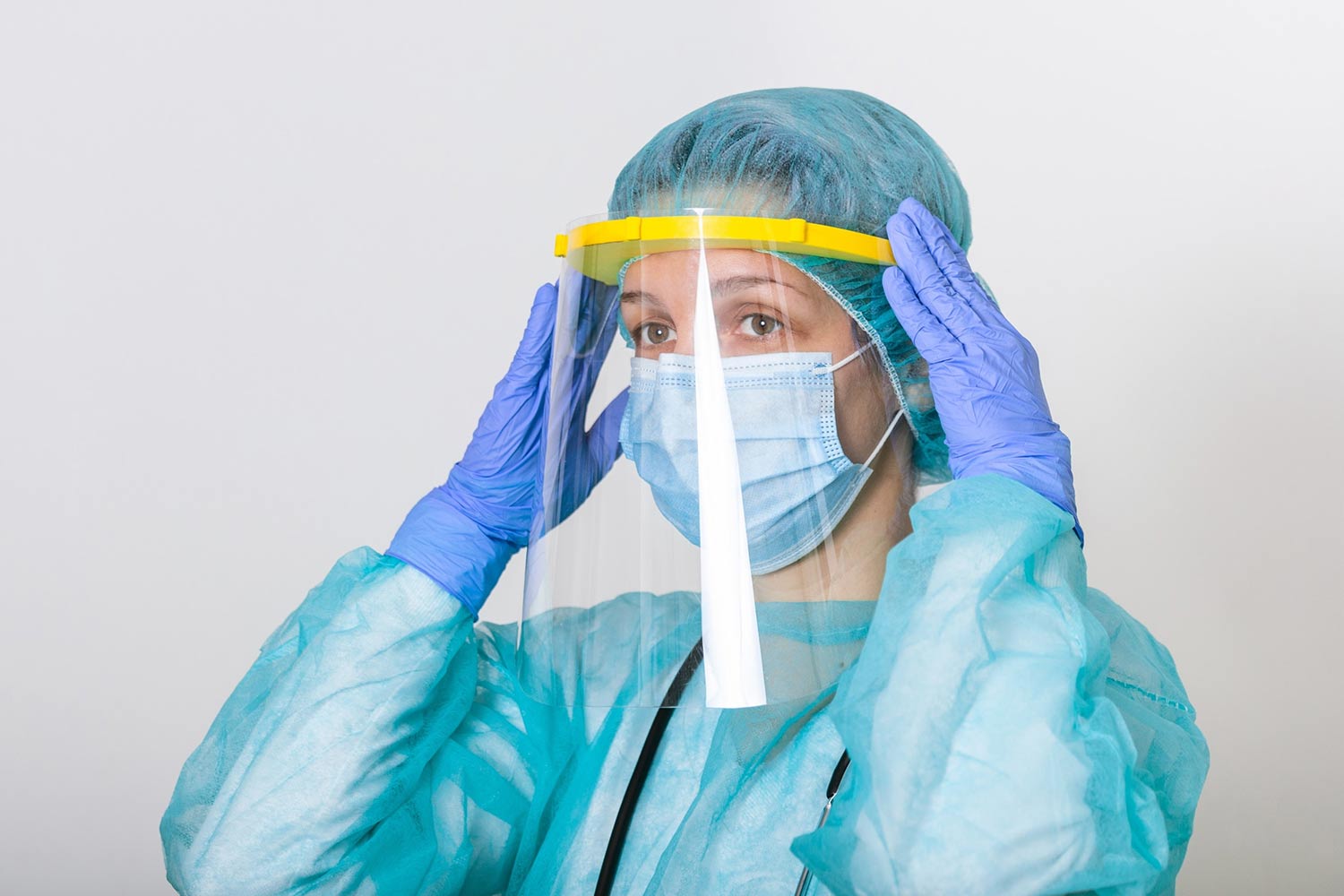 Female nurse in a mask and other PPE gear